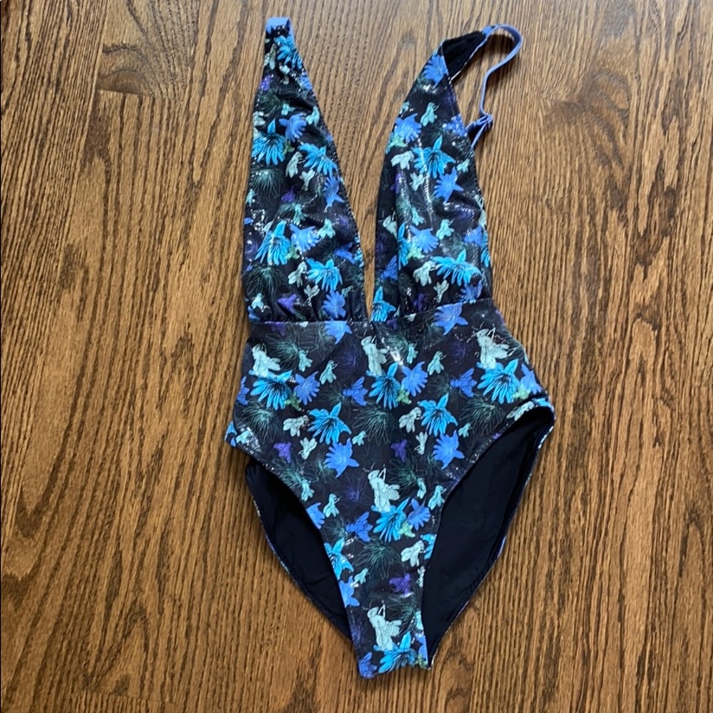 Never worn size xs one one one piece